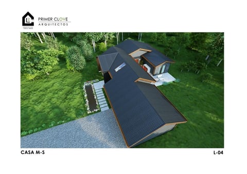 Aerial view of a modern modular black-roofed house with wooden accents nestled in lush green surroundings, showing its geometric design and landscaping.
